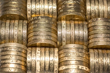 Close up of one pound coins stack.