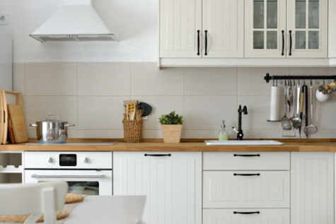 Interior shot from a white Scandinavian style white kitchen in an apartment.